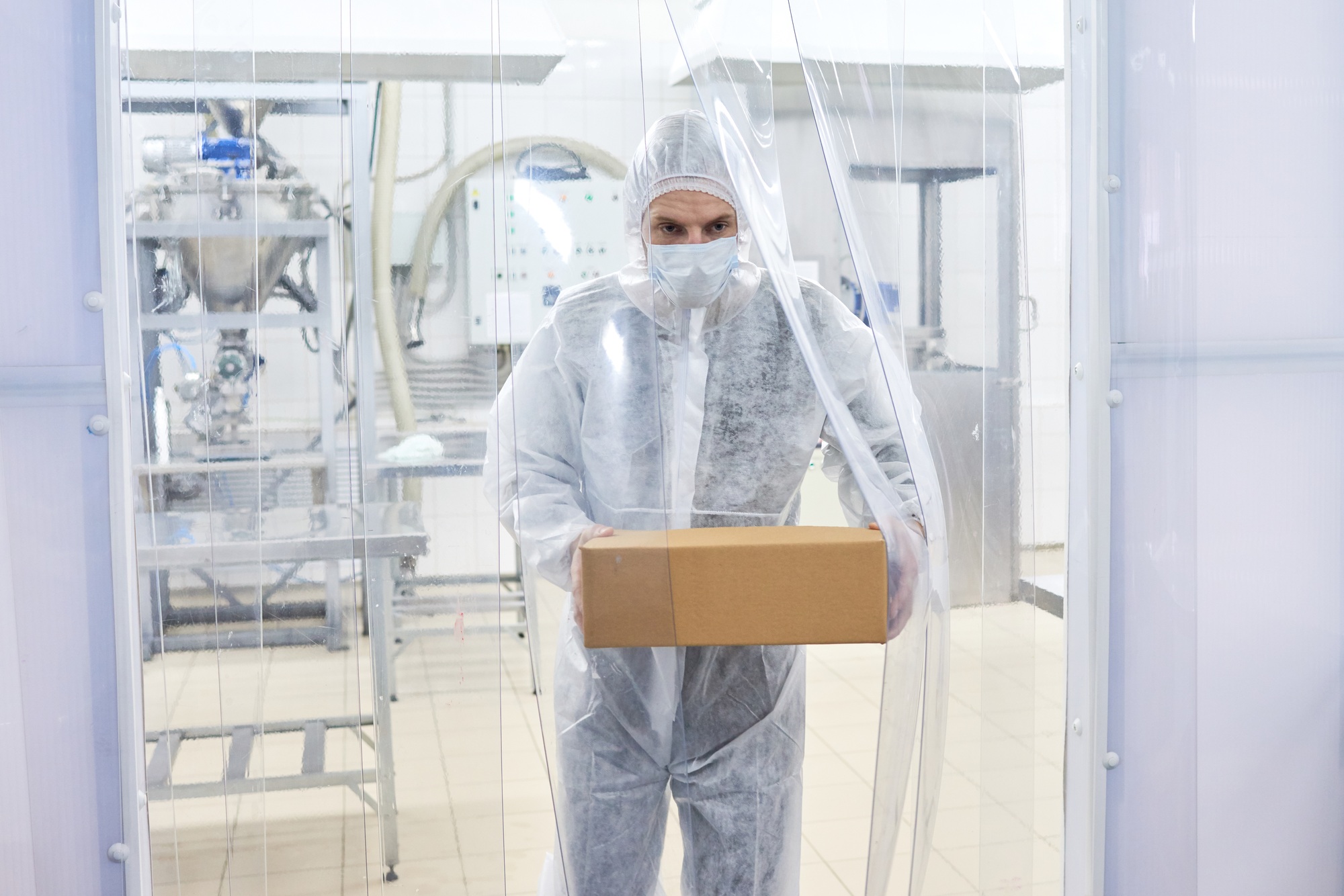 Pharmaceutical Lab Worker Carrying Box