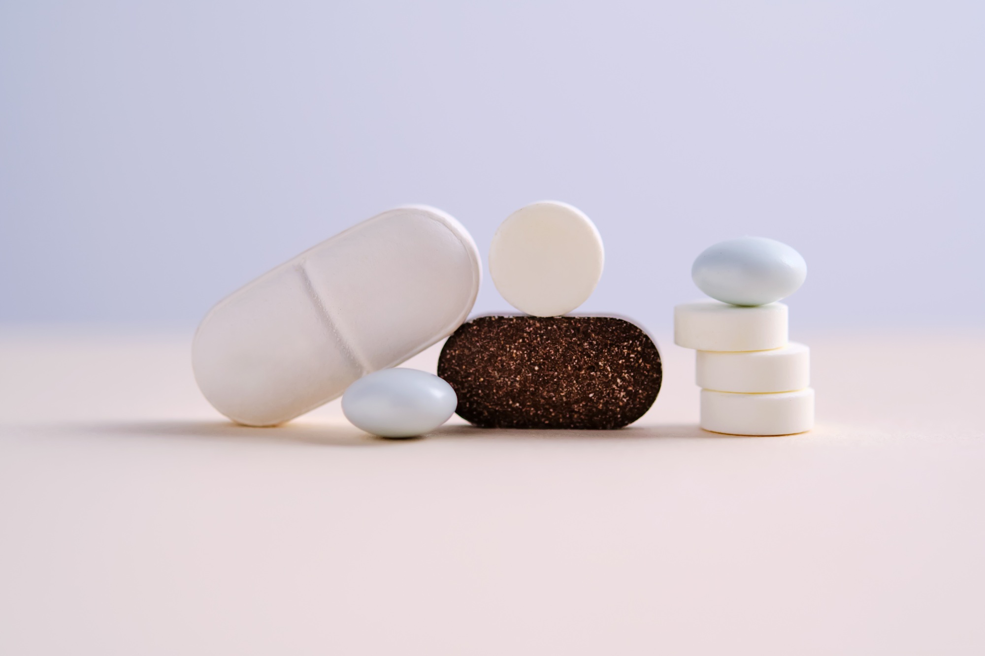 Pills and antibiotics on a blue background.